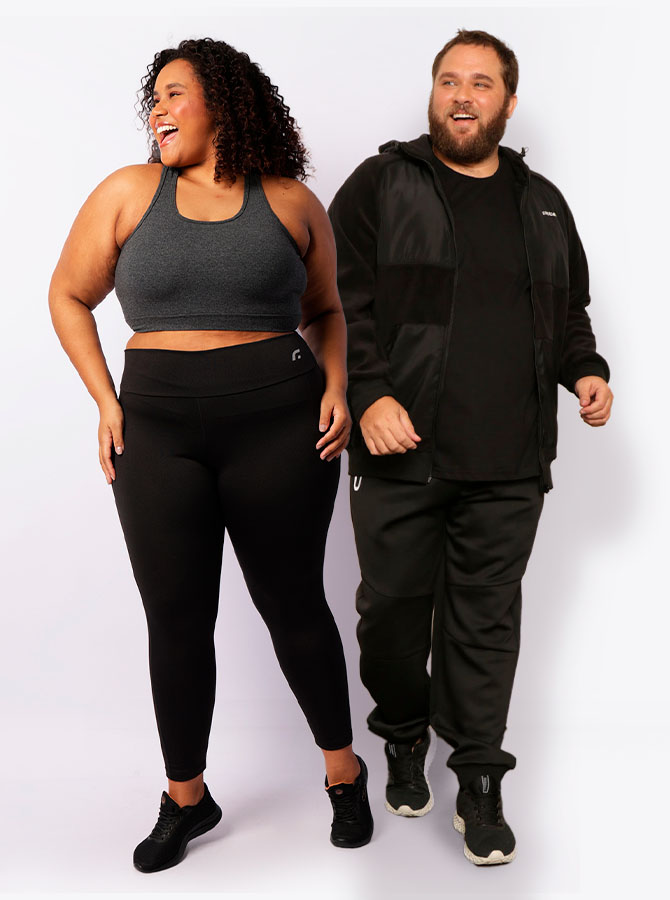 Mulher e homem plus size com roupas esportivas